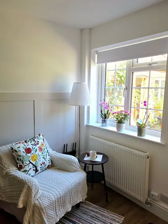 The living room armchair beside the window