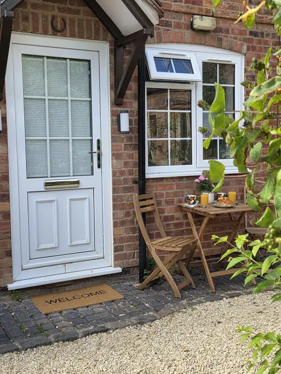 The front door of 3 Castle Mews under the porch canopy