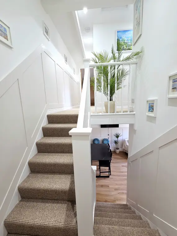The staircase seen from the landing looking down