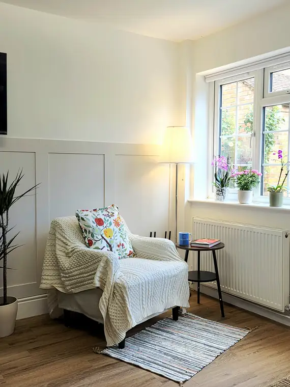 The living room in evening lamplight
