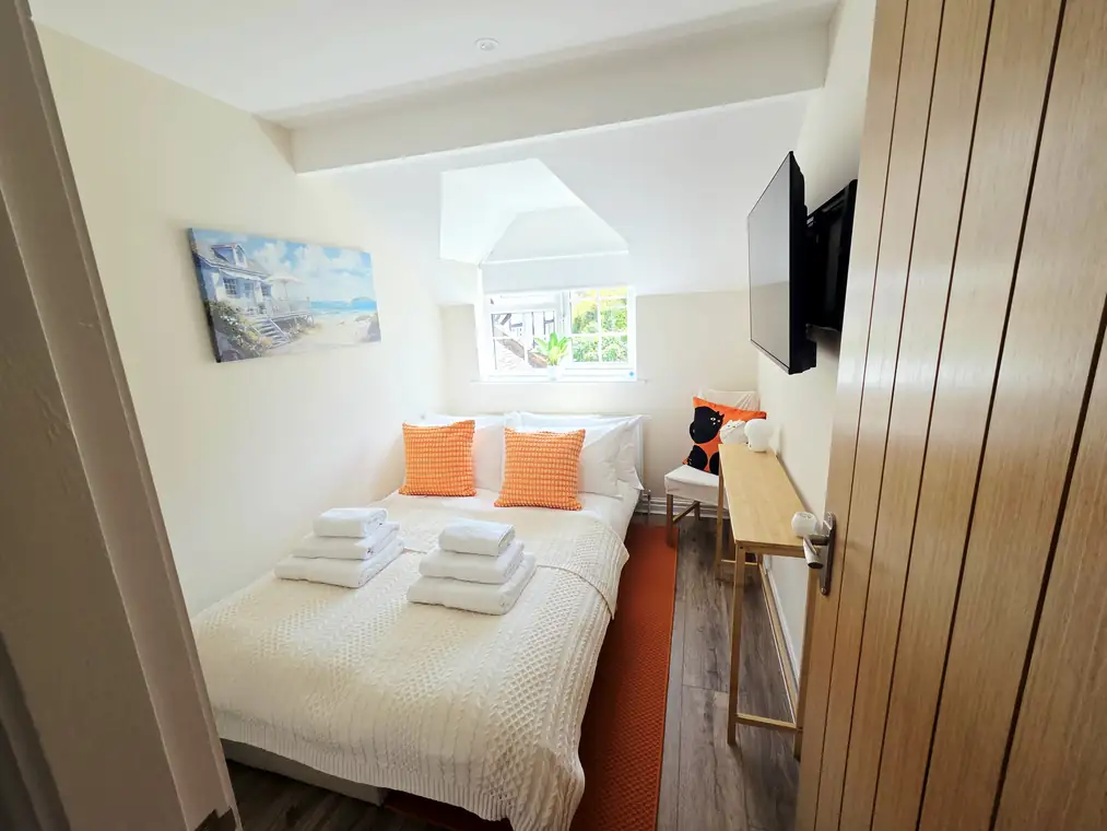 The second bedroom seen wide from the doorway