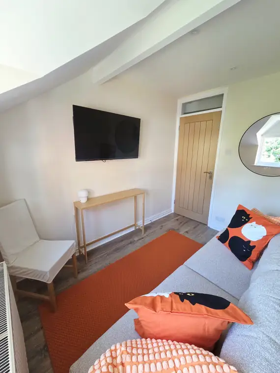 The second bedroom as a snug, sofa bed folded away