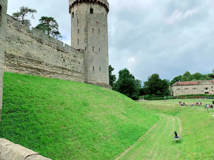 Caesar's Tower at Warwick Castle seen across the green mound