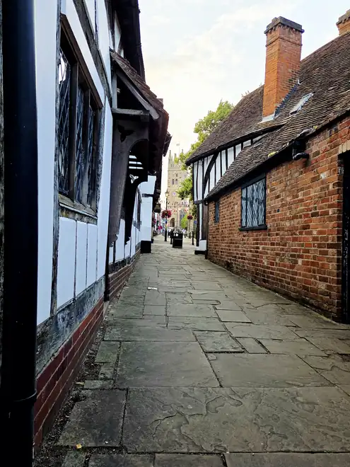 The footpath between timber-framed buildings