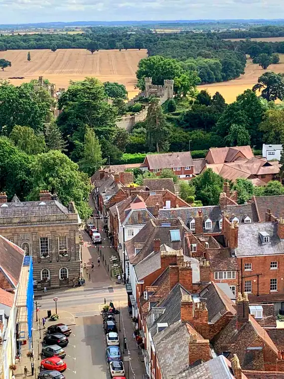 Castle Street running towards Warwick Castle, seen from St Mary's church tower, with farmland beyond